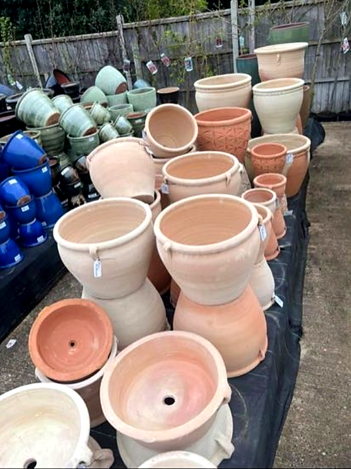 Terracotta and glazed pots stacked in the pot yard